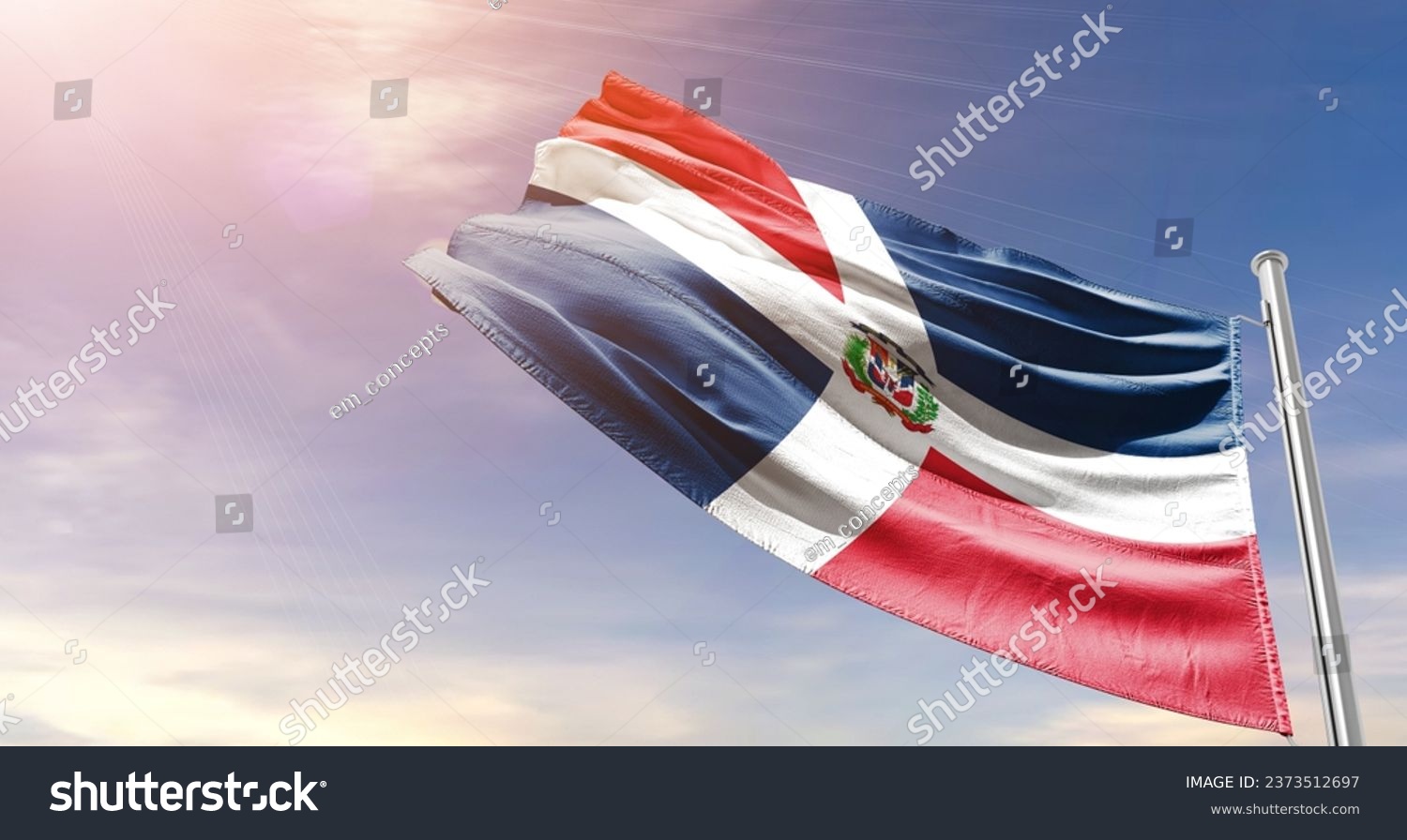 Dominican Republic national flag waving in beautiful sky. The flag waving with dynamic angle. #2373512697