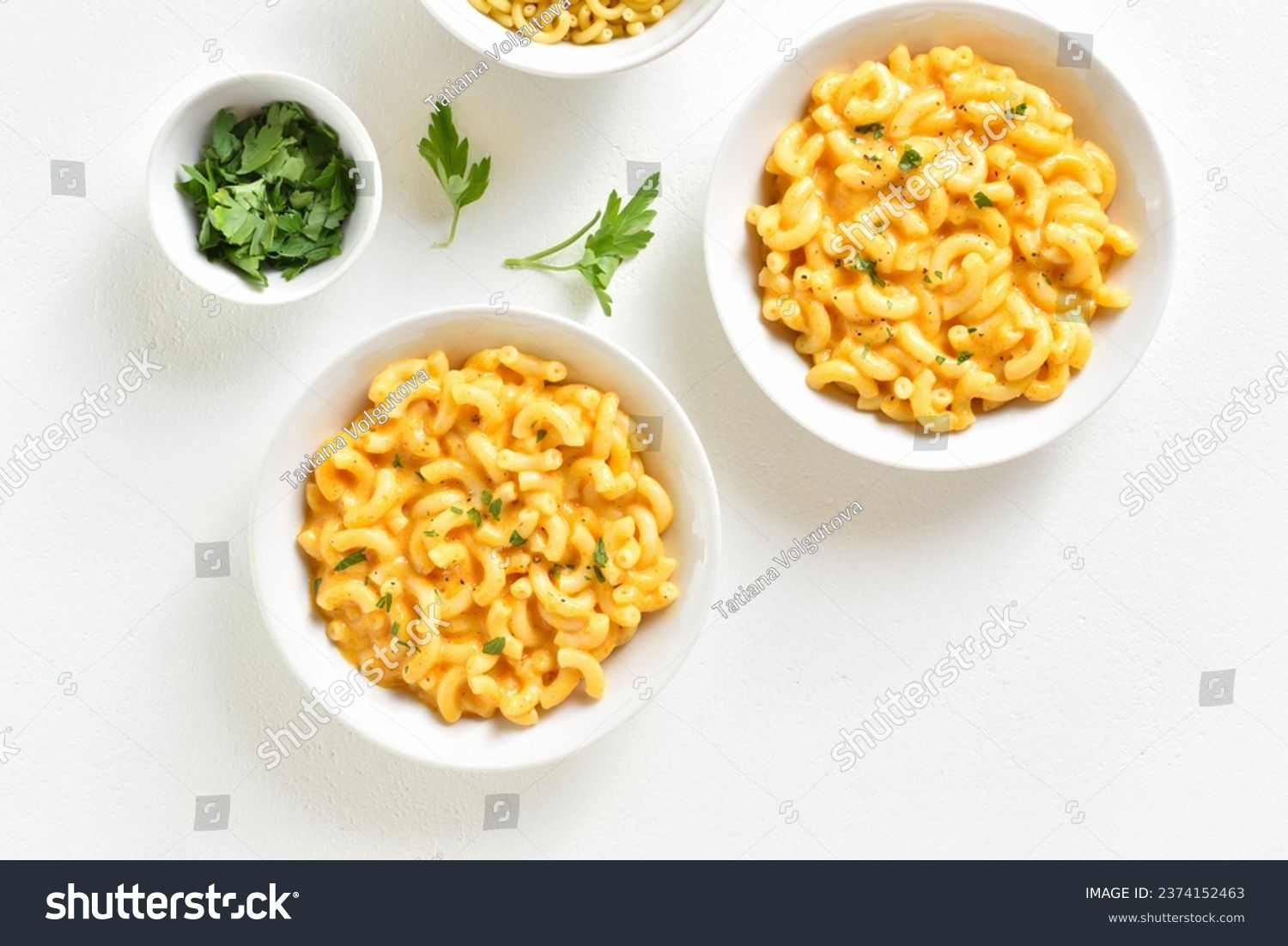 Macaroni and cheese in bowl over white background. Top view, flat lay #2374152463
