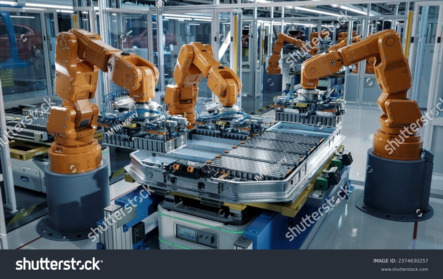 Advanced Orange Industrial Robot Arms Assemble EV Battery Pack on Automated Production Line. Row of Robotic Arms inside Automotive Plant Assemble Batteries. Modern Electric Car Smart Factory. #2374630257