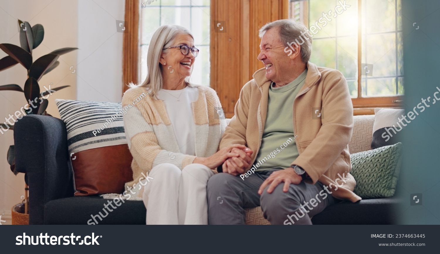 Love, relax and senior couple laughing at funny joke, enjoy quality time together and bond on home living room sofa. Retirement, smile and elderly man, woman or people happy #2374663445