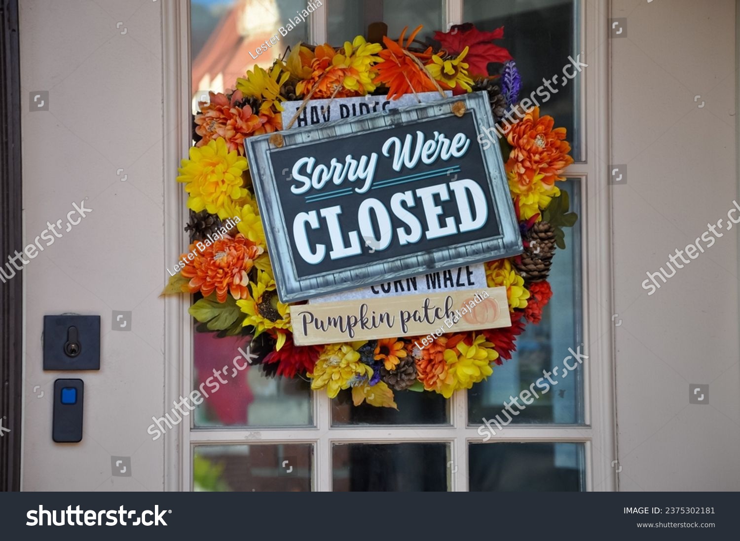 Sorry we're closed sign hanging in a door #2375302181