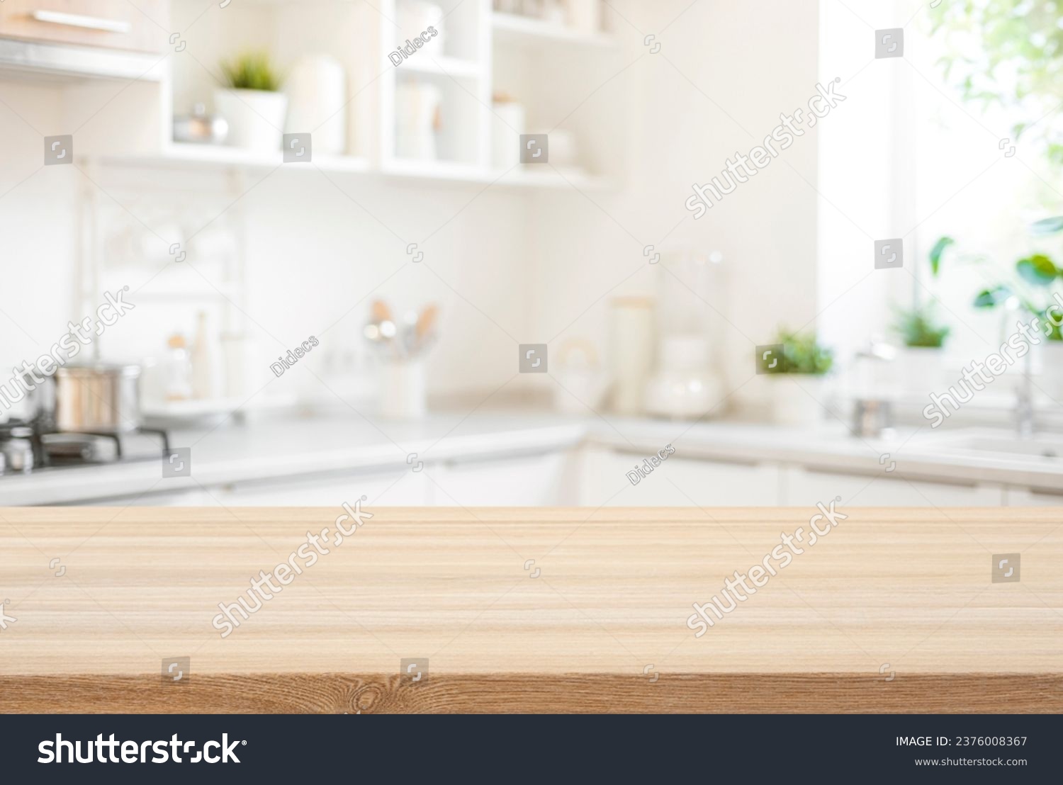 Wooden table top view for product montage over blurred kitchen interior background #2376008367