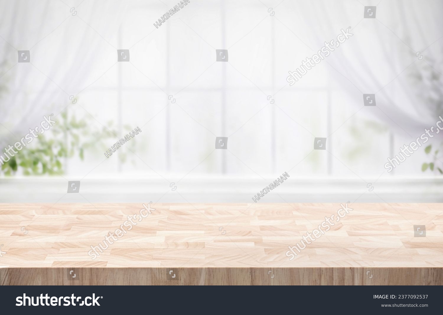 Selective focus.Wood table counter on blur curtain window in morning cozy home background.For montage product display or design key visual #2377092537
