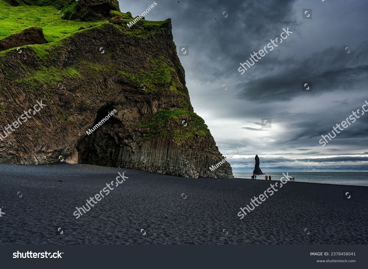 Dramatic landscape of Halsanefshellir cave with Reynisdrangar natural rock formation on Reynisfjara black sand beach in gloomy day during summer at South of Iceland #2378458041
