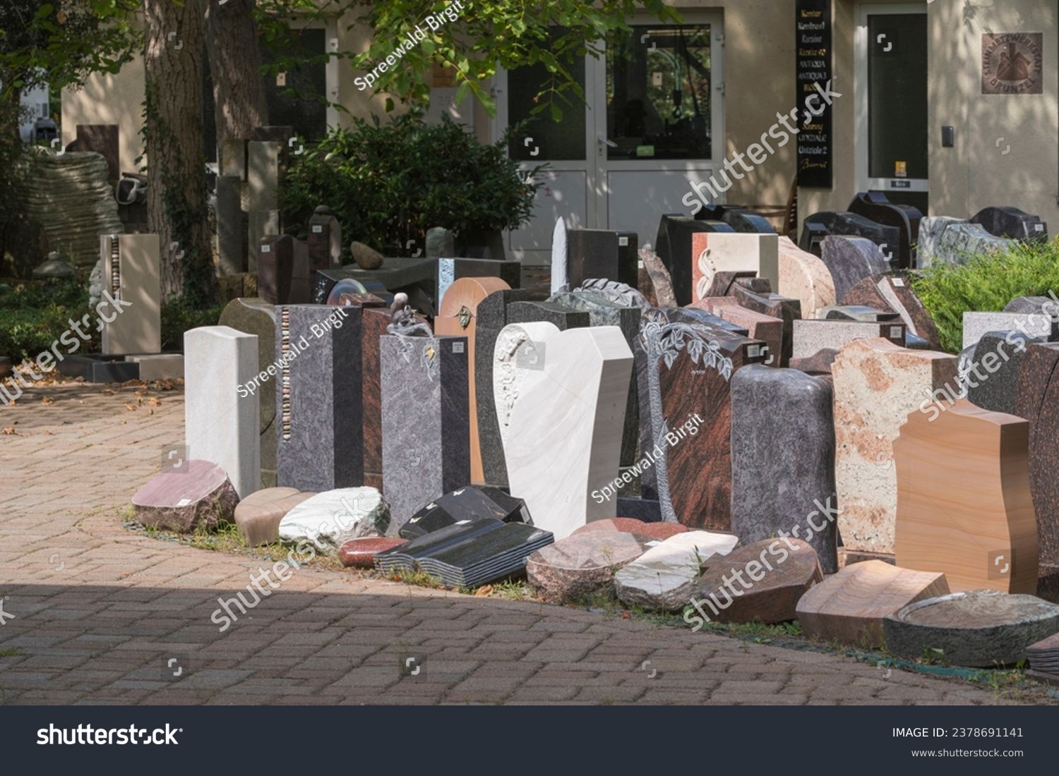 Gravestones at a stonemason issued for sale to the survivors #2378691141