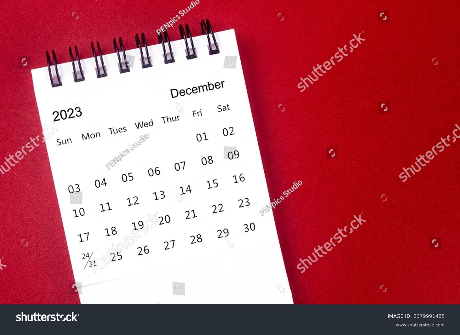 December 2023 Monthly desk calendar for 2023 year on red background. #2379991485