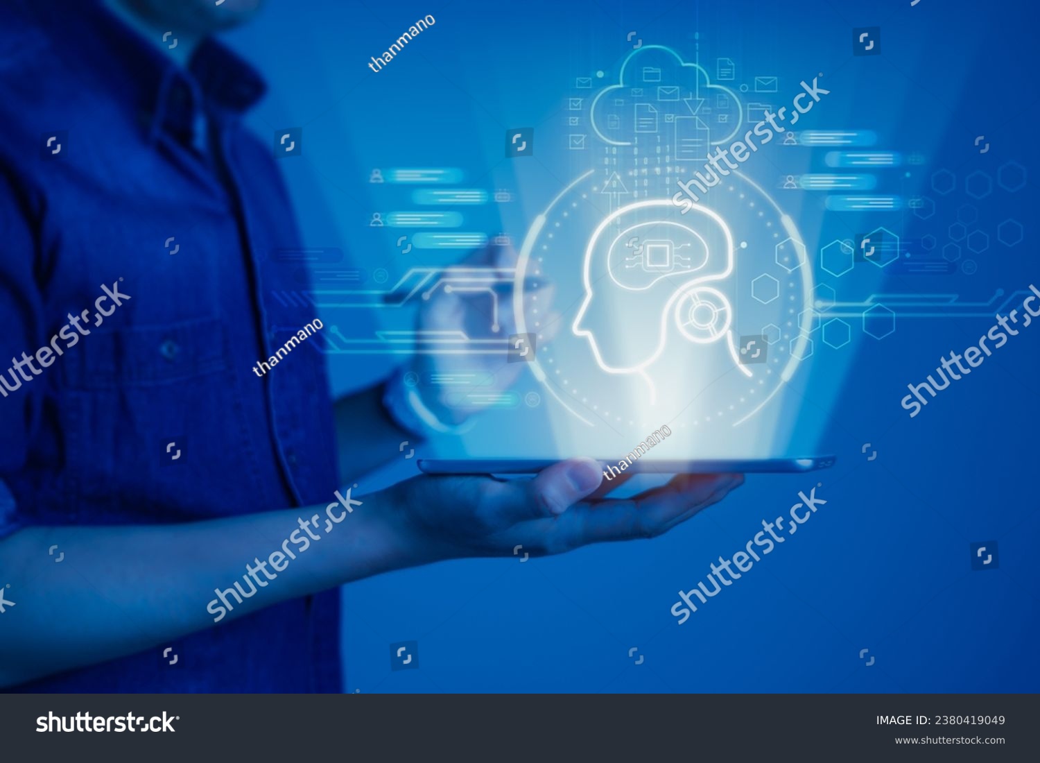 Man holding a tablet with a virtual display screen showcasing the artificial intelligence (AI), innovation and automation with AI prompts and chat assistant capabilities on display #2380419049