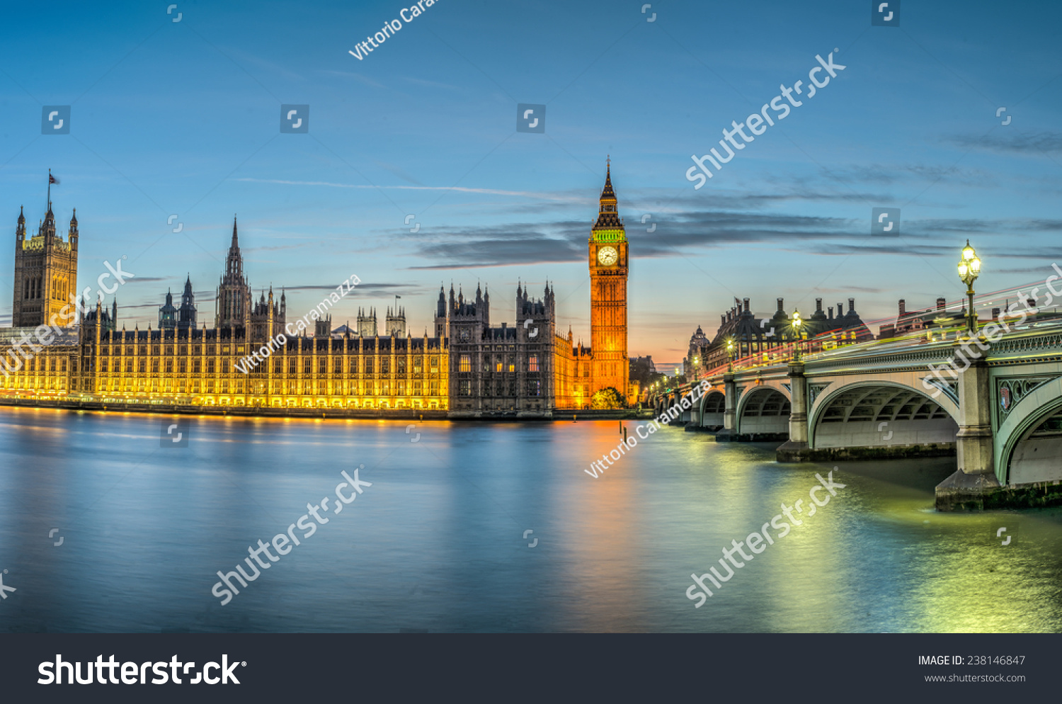 London, the House of Parliament, with the Big Ben and Westminster bridge at dusk #238146847