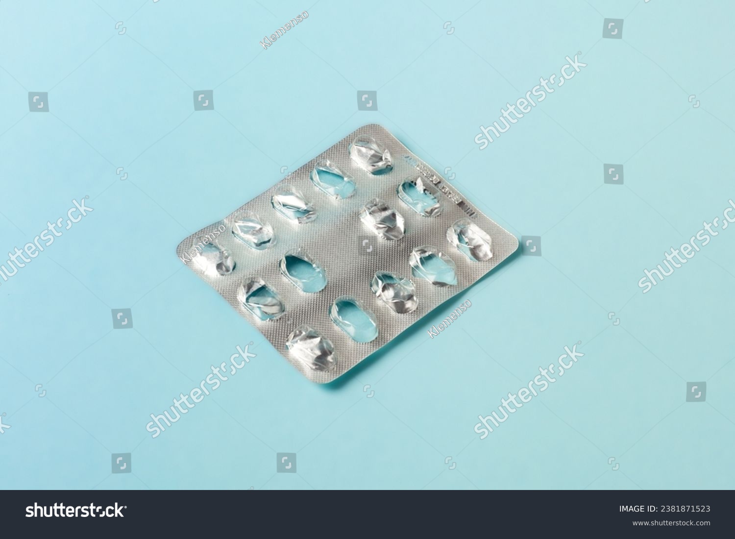 empty blister pack of pills on blue background. healthcare and medicine concept #2381871523