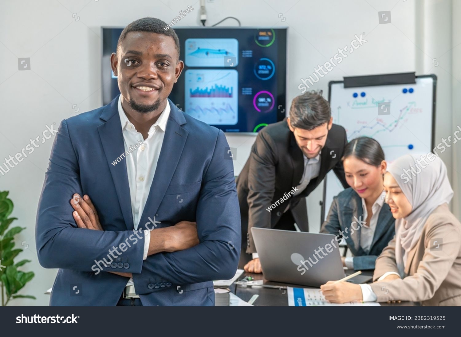 leader supervisor entrepreneur and manager smile and crossed arms for show happy working in office company. leader colleague looking showing arm cross in meeting room multiracial teamwork background. #2382319525