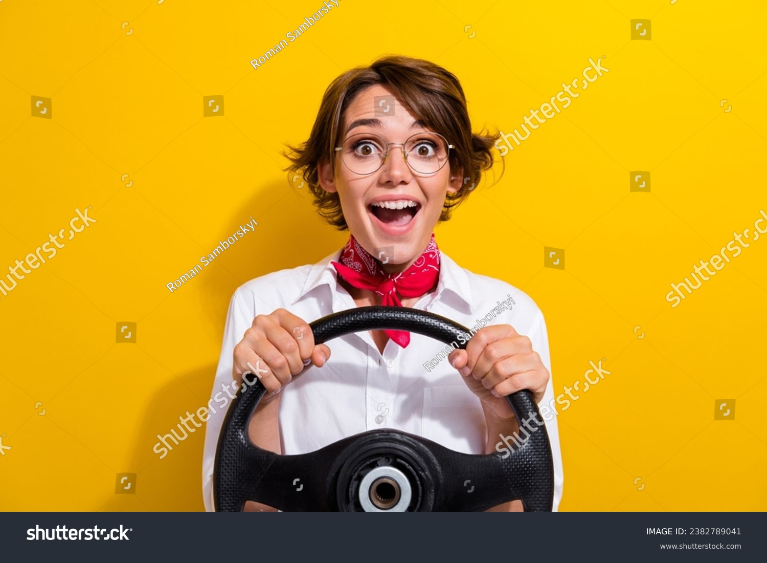 Photo of excited cheerful girl wear trendy outfit hold steering wheel driving own car weekend trip isolated on yellow color background #2382789041
