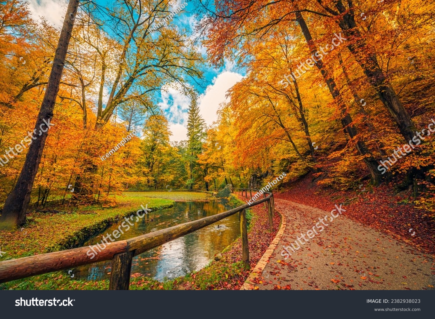 Mountain trail with calm lake, amazing autumn colors of leaves trees, sunny dream landscape. Beauty of nature concept background. Adventure hiking freedom stunning forest natural scene. Majestic view #2382938023