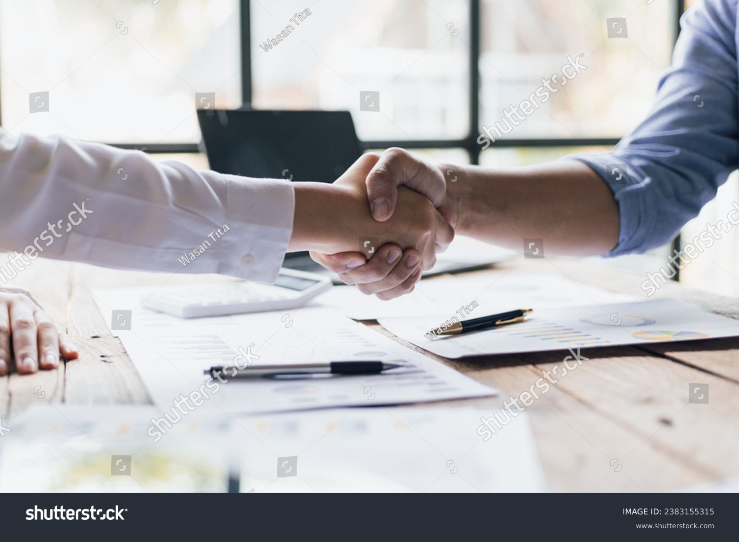 Business people shaking hands in business partnership meeting. #2383155315