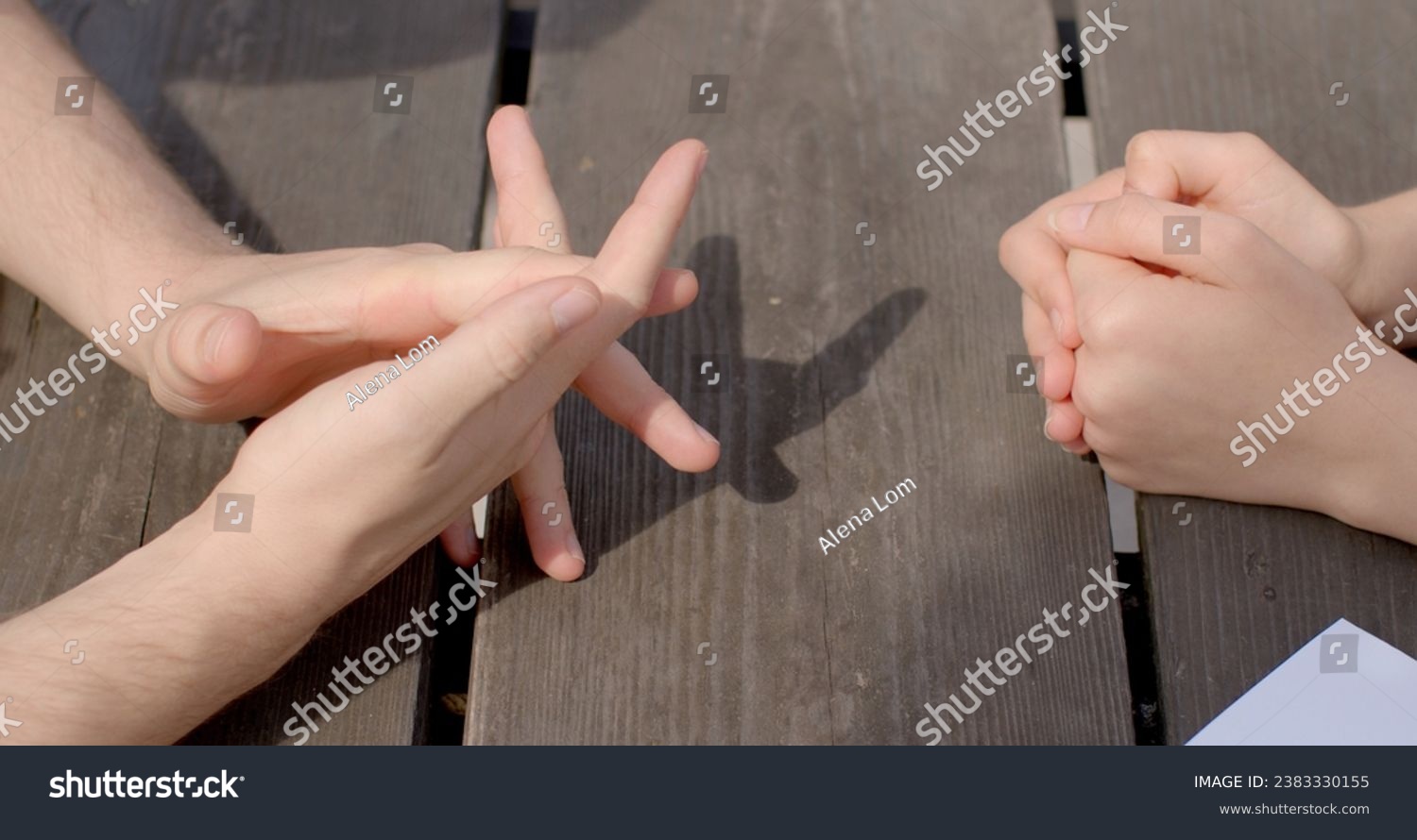 Close-up hands during discourse time. Gesture nonverbal form of communication during conversation that convey meanings, emotions, ideas. Gestures enhance spoken language, young people body details.  #2383330155