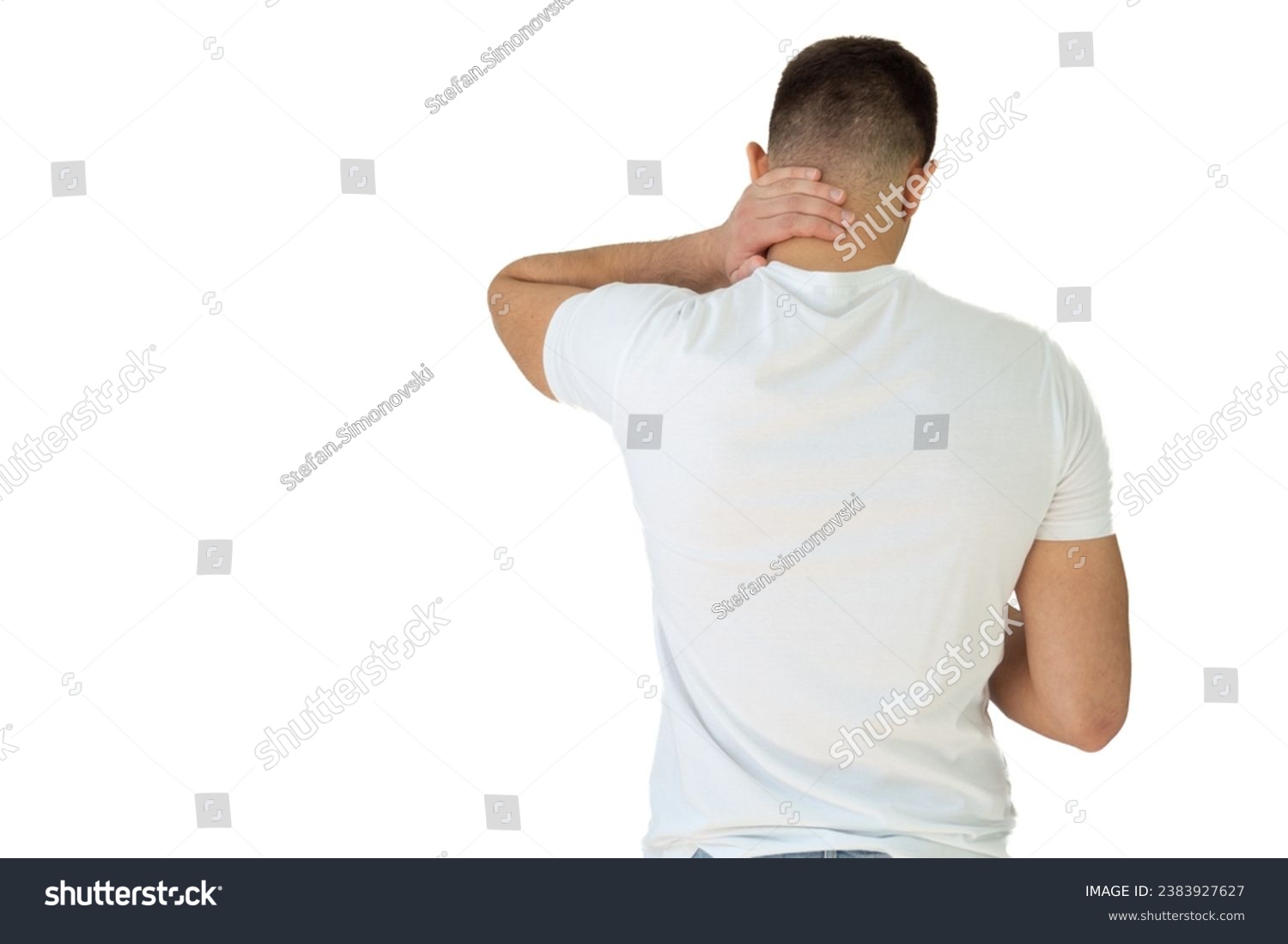 Rear view of a handsome young man in white shirt holding his back and neck in pain isolated on white background, man giving himself a massage on his neck, young man having a back and neck pain #2383927627
