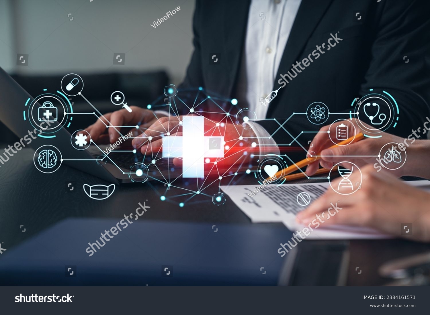 Businesspeople typing on laptop at office workplace. Concept of team work, business education, internet surfing, brainstorm, project information technology. Hands shot. Medical healthcare hologram #2384161571