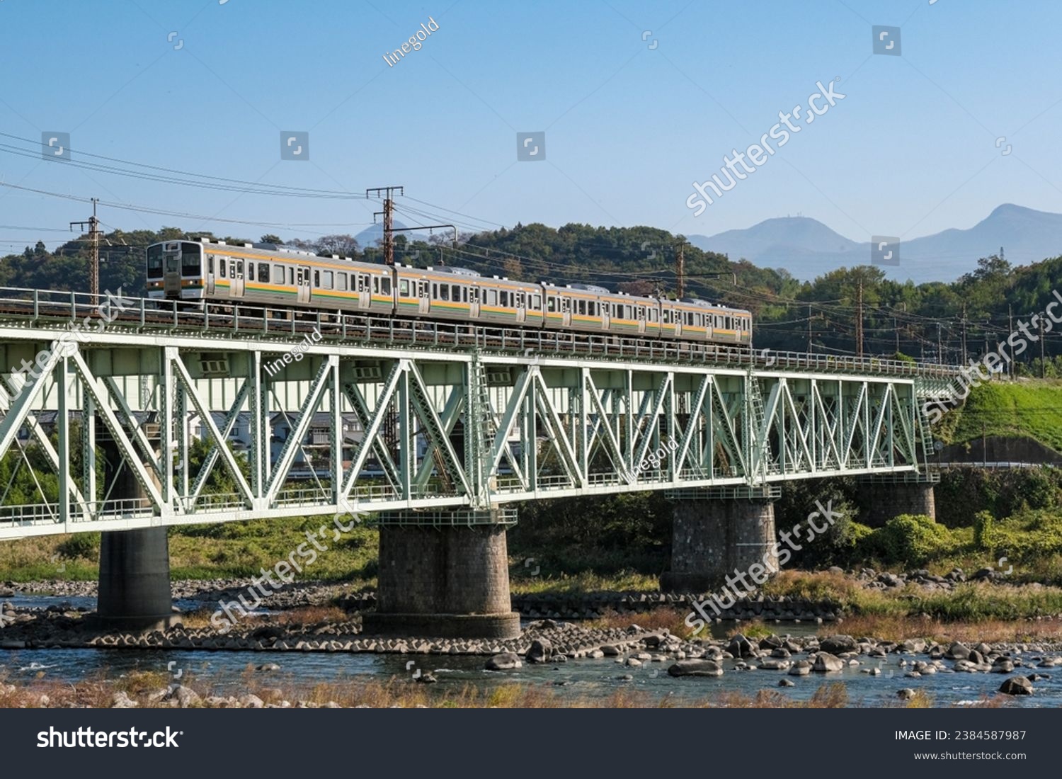 Joetsu Line local train crossing the Tone River iron bridge #2384587987