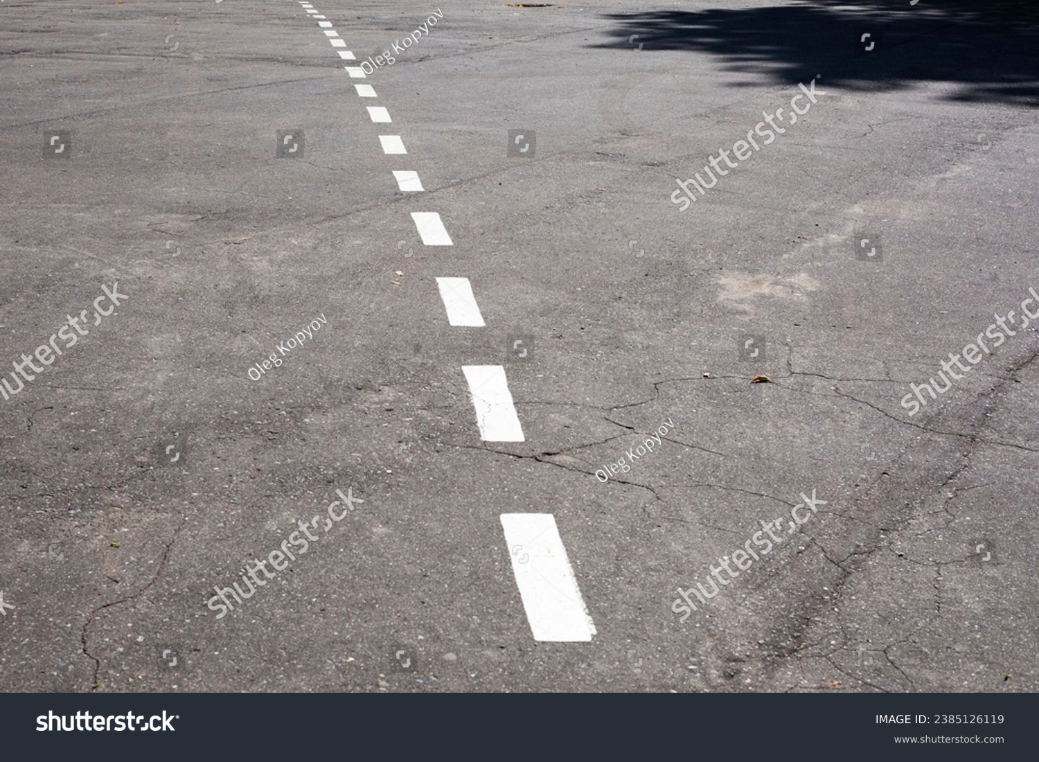 Dashed line. Markings on the road. White dotted line on the asphalt. Road markings on the highway. #2385126119