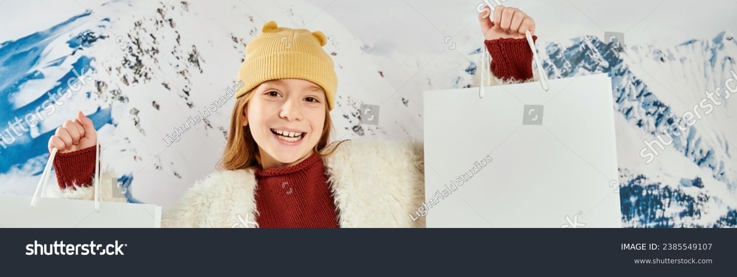 cute preteen girl in stylish jacket with present bags smiling at camera, fashion concept, banner #2385549107