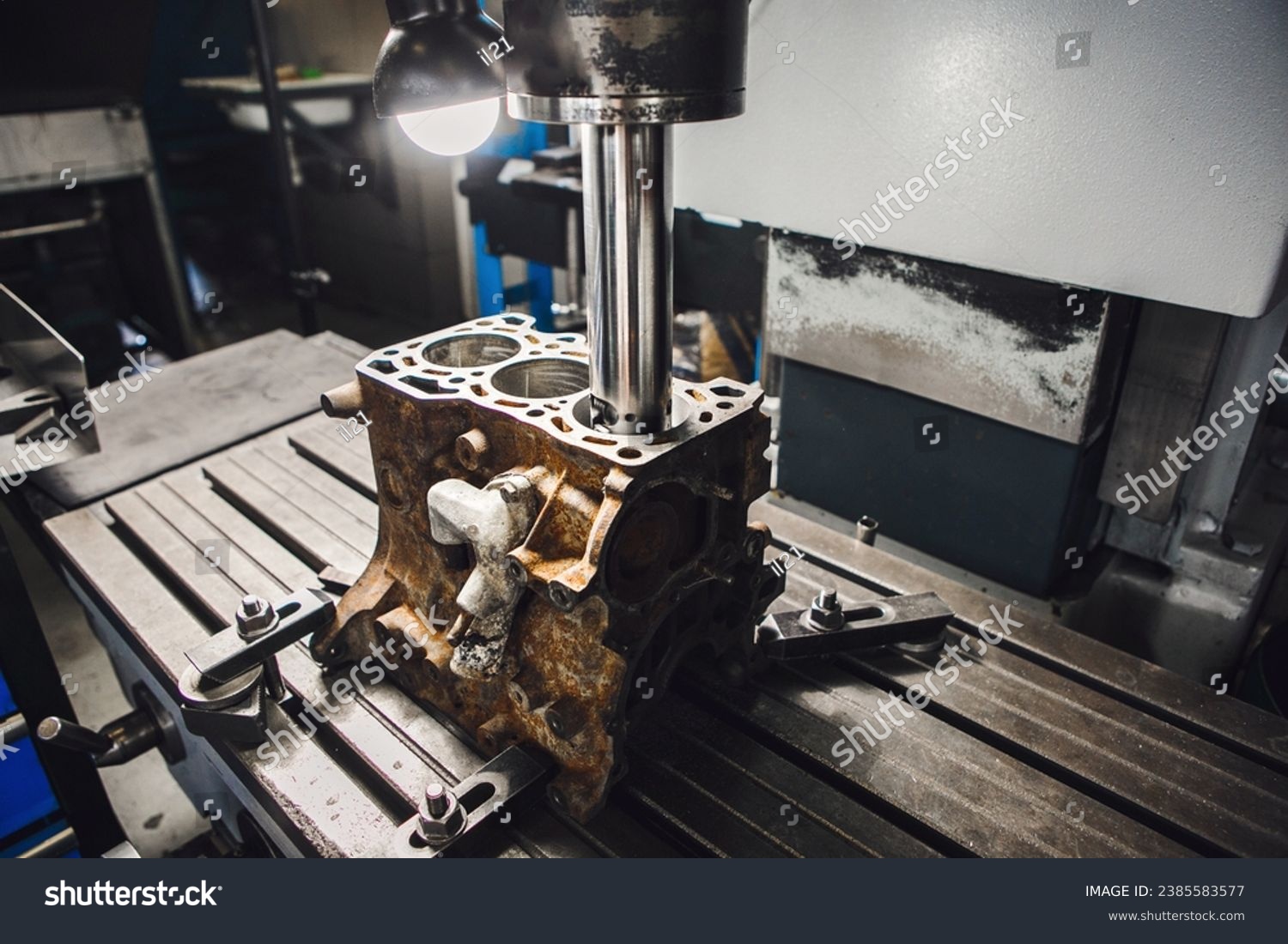Engine cylinder boring on cnc machine. Boring under the piston after engine sleeve using machine with Computer Numerical Control. #2385583577