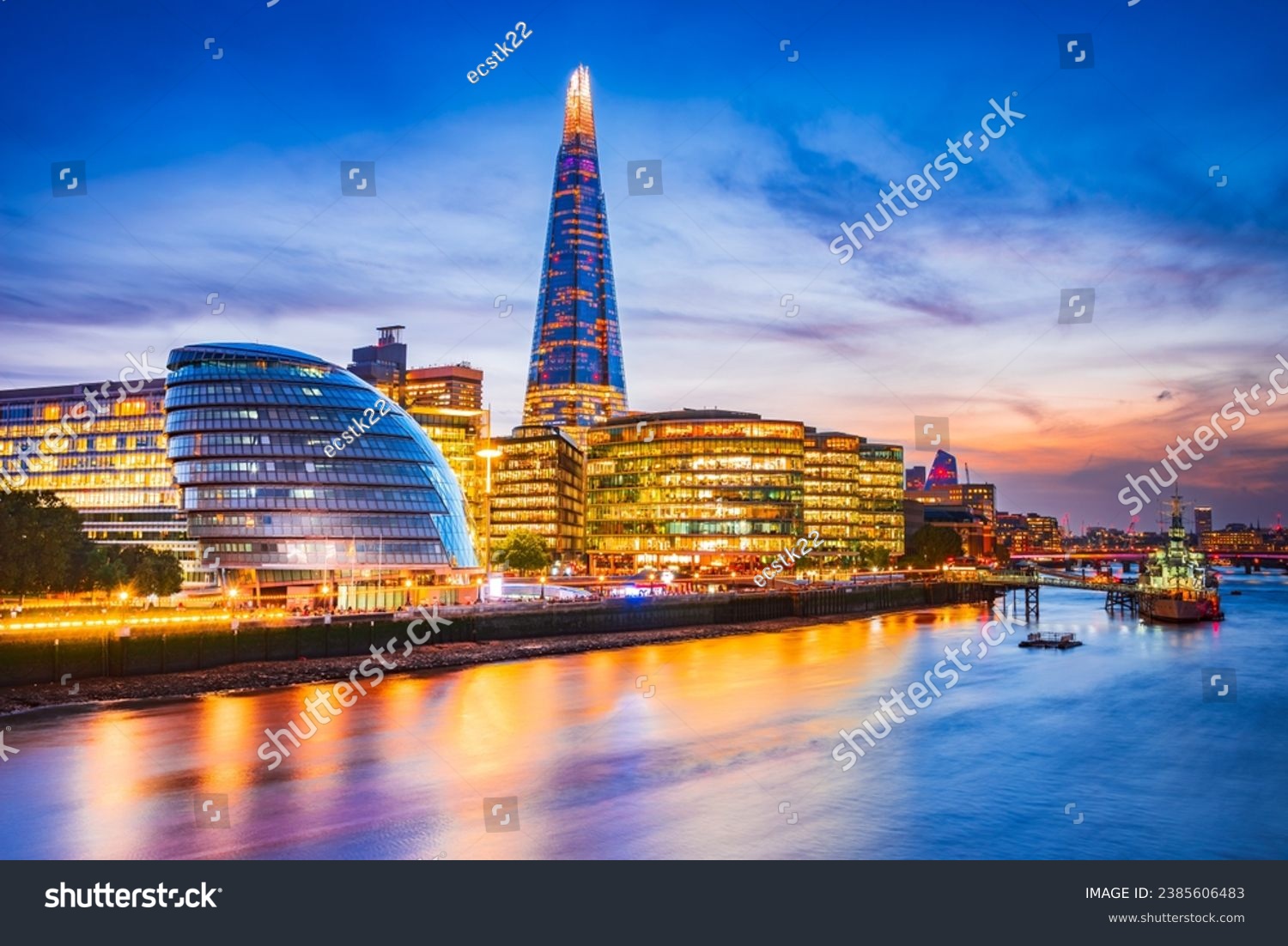 London, United Kingdom. Skyline view of the famous New London, City Hall and Shard, golden sunset hour. View includes Thames River, skyscrapers, office buildings and beautiful sky. #2385606483