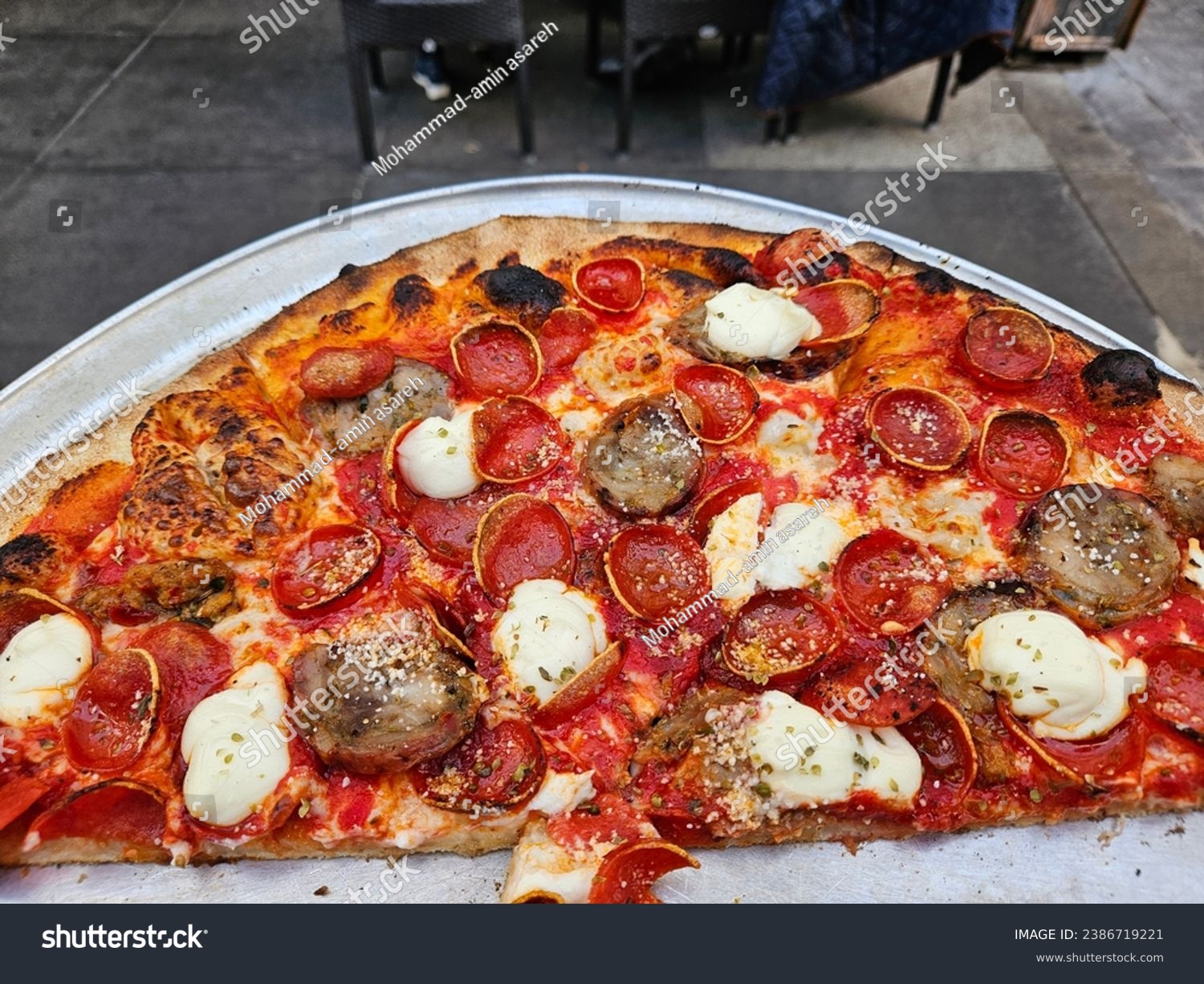 Famous Pizza place in the Italian district of san Francisco California referred to as Tony's Pizza #2386719221