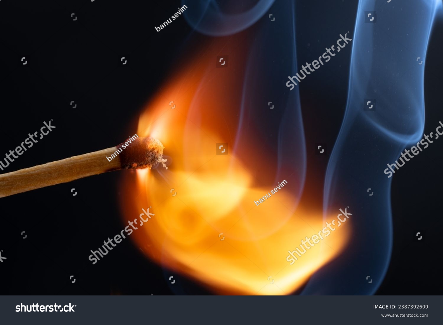 a wooden safety matchstick burning  #2387392609