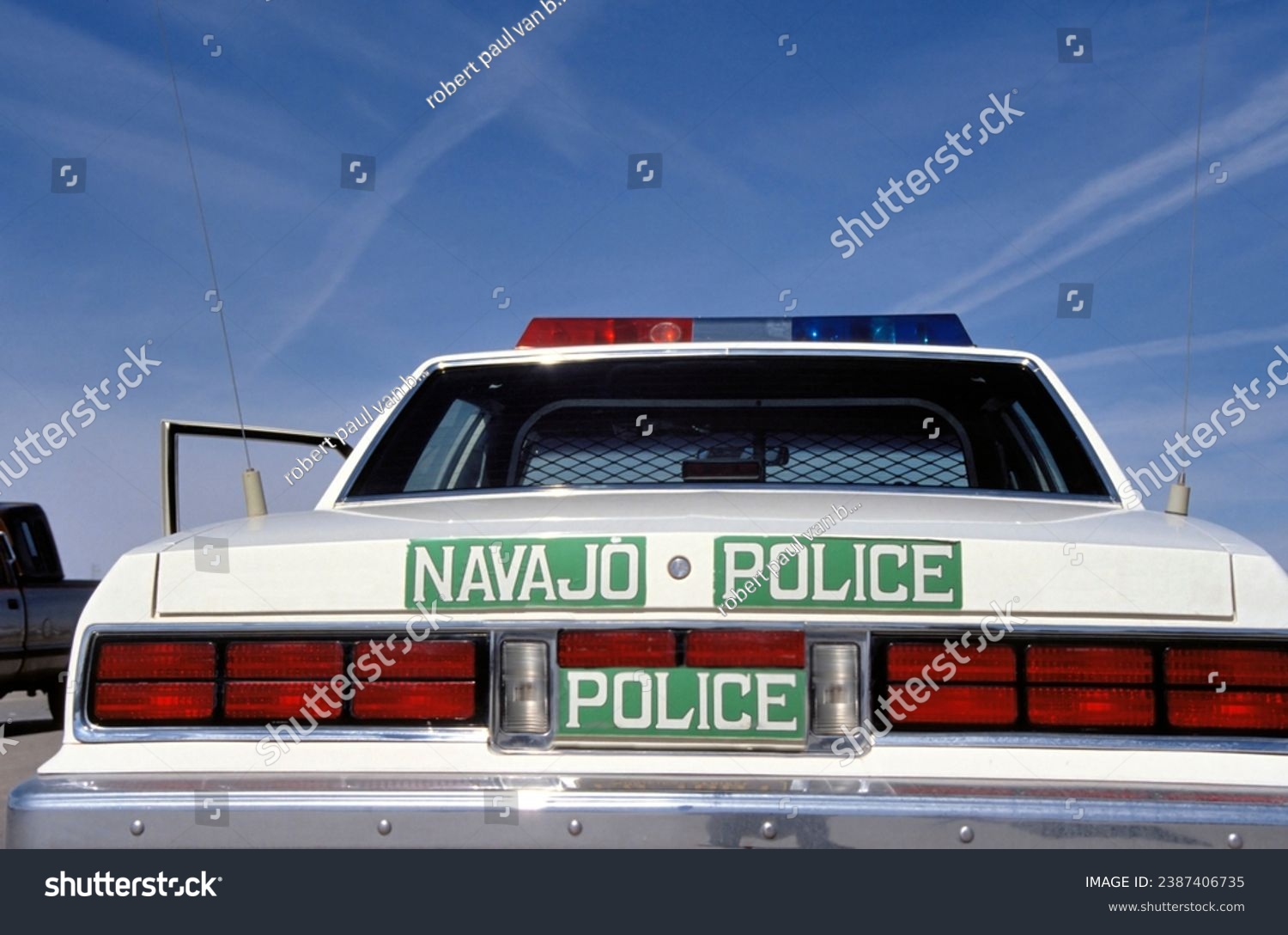 Car of the Navajo Nation Police with a clear blue sky #2387406735