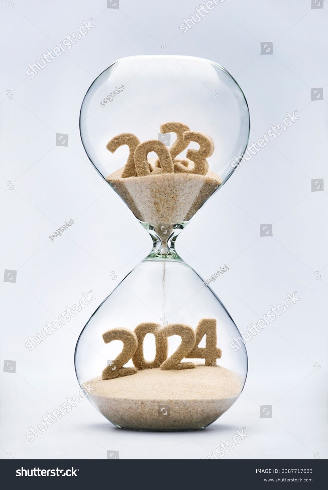 New Year 2024 concept with hourglass falling sand taking the shape of a 2024 #2387717623
