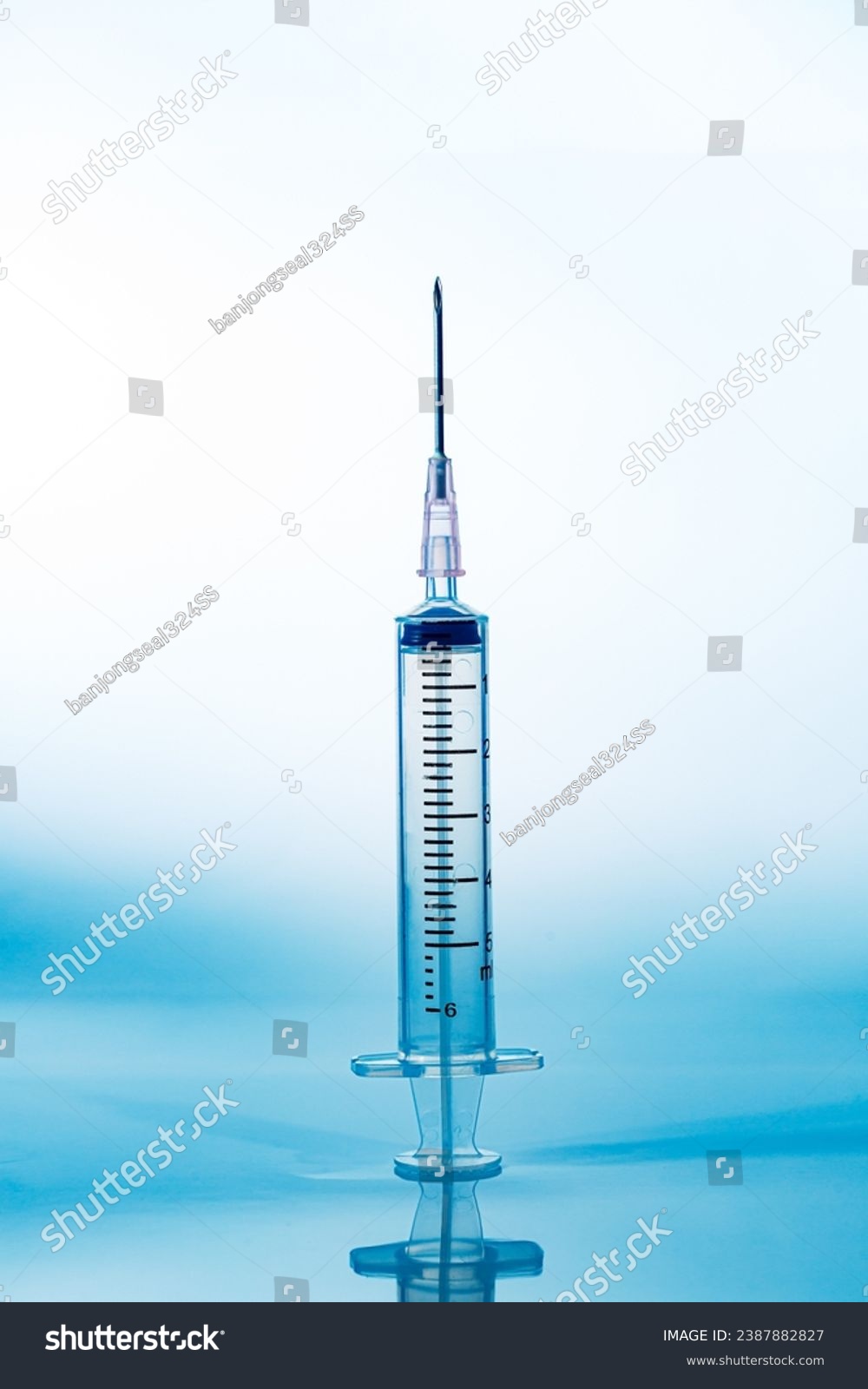 macro syringe,A 5ml syringe and needle isolated on a white background with detailed clipping path,Close up of a syringe. Focus on numbers. #2387882827