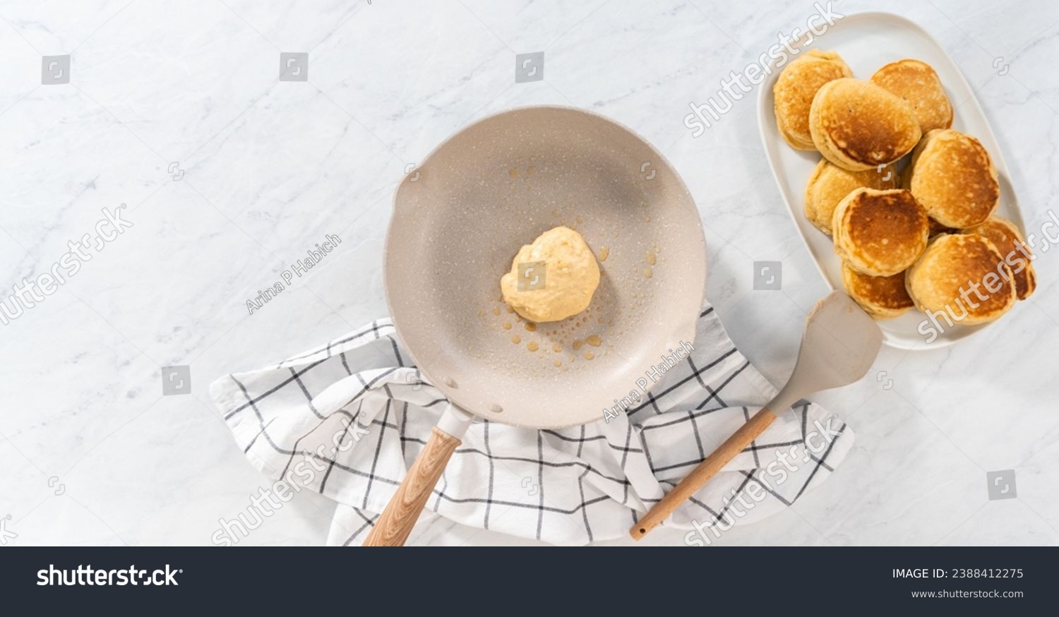Flat lay. Preparing eggnog pancakes in a nonstick frying pan. #2388412275