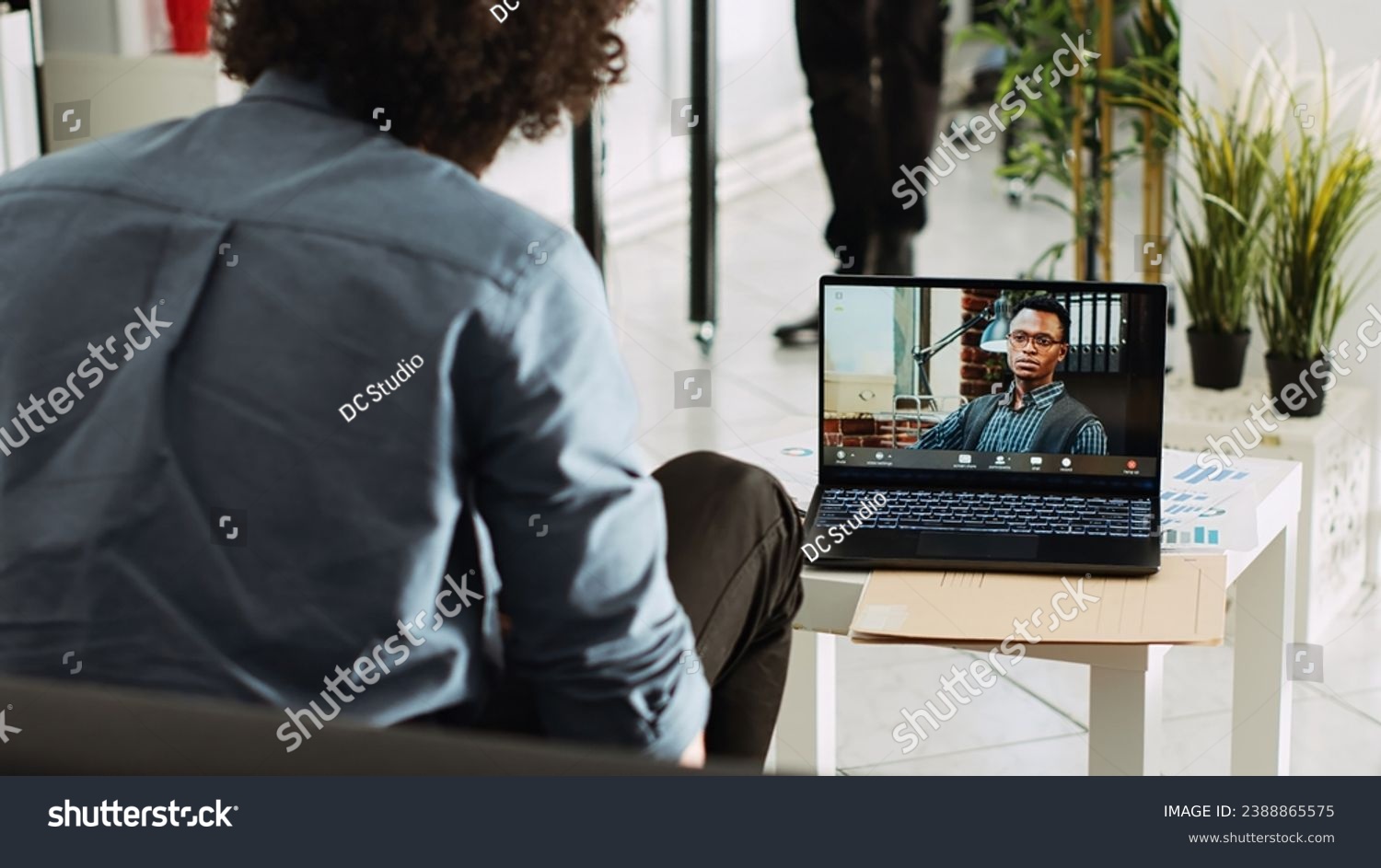 Diverse people meeting on online call, consultant using videoconference chat to present small business vision. Young employee talking to coworker on remote telework videocall. Tripod shot. #2388865575