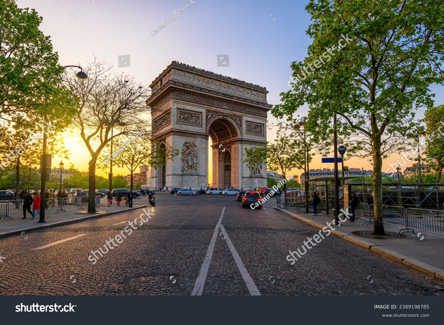 Paris Arc de Triomphe (Triumphal Arch) in Chaps Elysees at sunset, Paris, France. Cityscape of Paris. Architecture and landmarks of Paris #2389198785