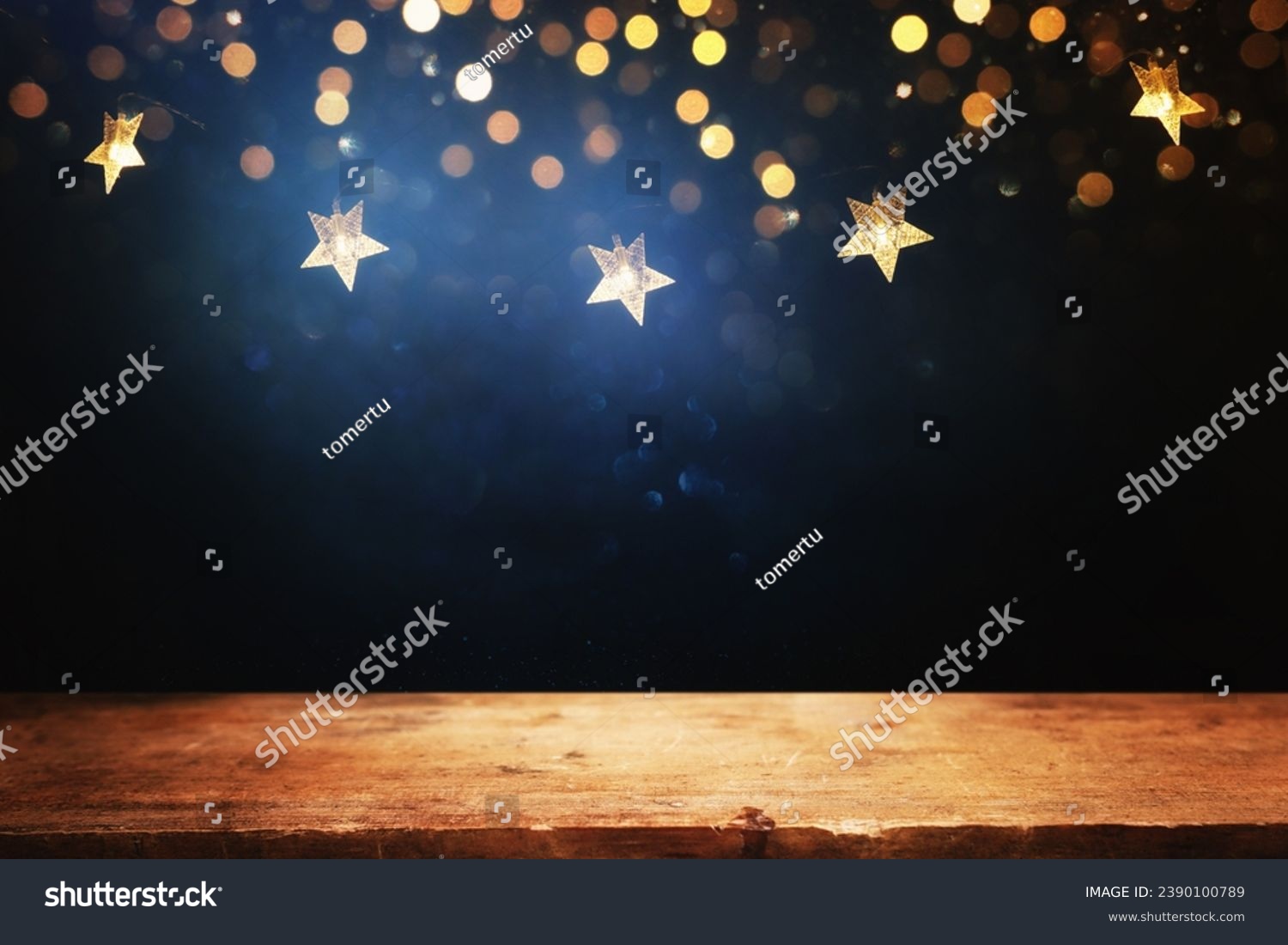 Empty wooden table in front of Christmas garland lights. ready for product presentation #2390100789