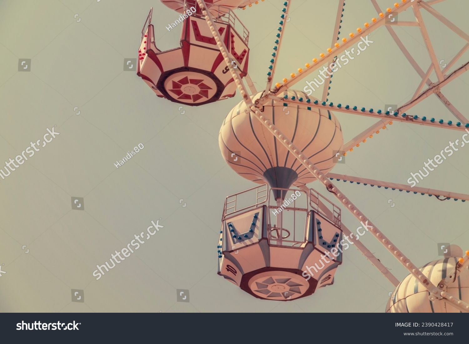 Ferris wheel on the background of blue sky #2390428417