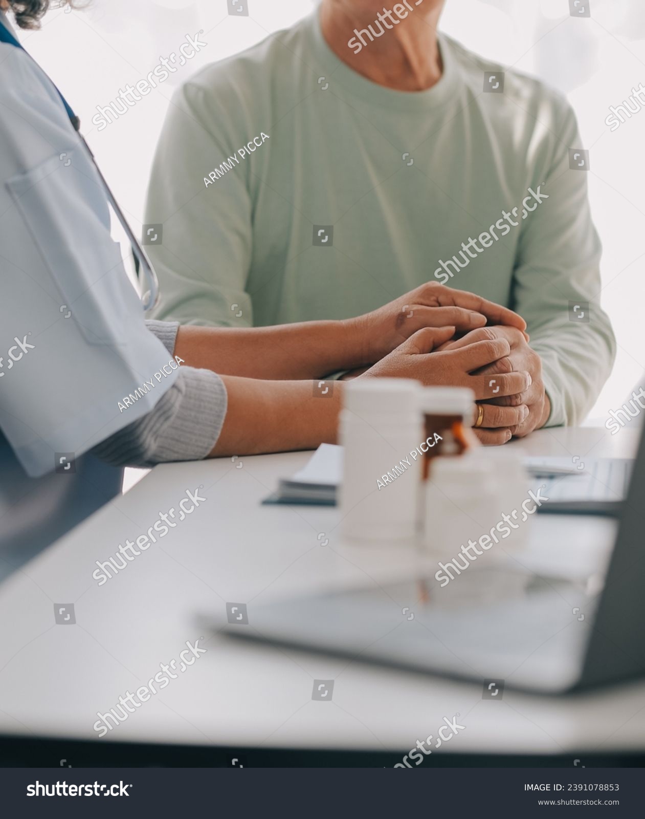 Doctor giving hope. Close up shot of young female physician leaning forward to smiling elderly lady patient holding her hand in palms. Woman caretaker in white coat supporting encouraging old person #2391078853
