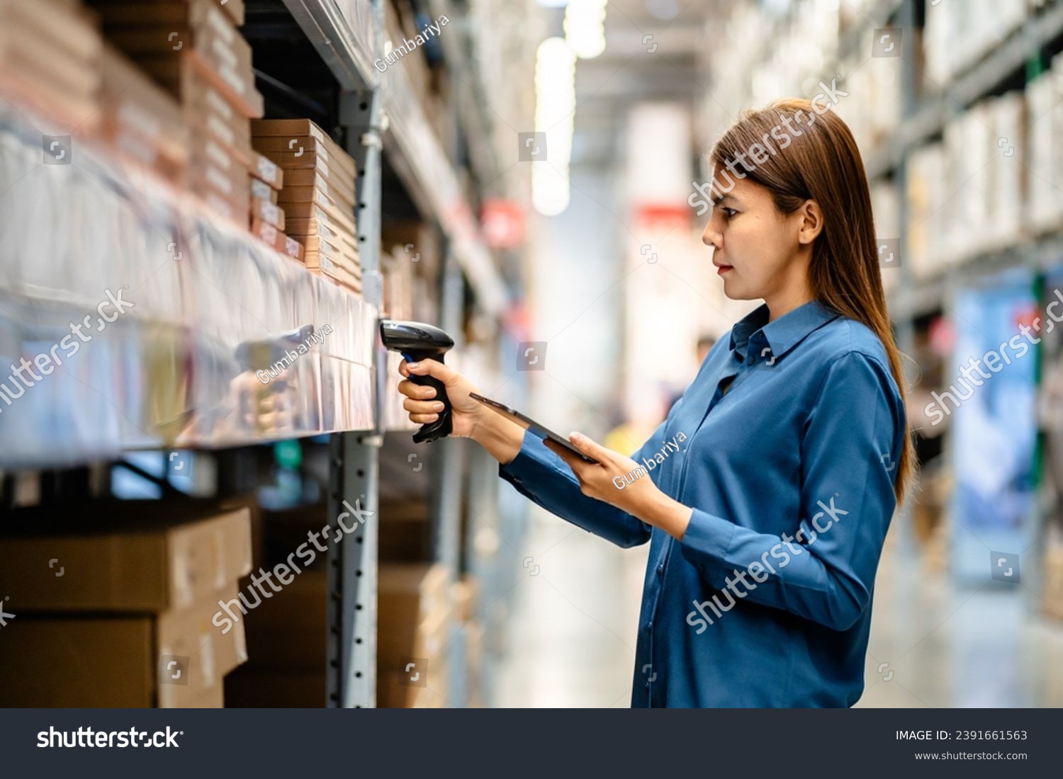Women worker use scanner to check and scan barcodes of stock inventory on shelves to keep storage in a system, Smart warehouse management system, Supply chain and logistic network technology concept. #2391661563