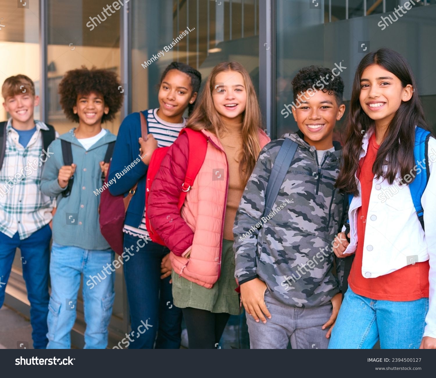 Portrait Showing Class Of Secondary Or High School Pupils Standing Outside School Building #2394500127