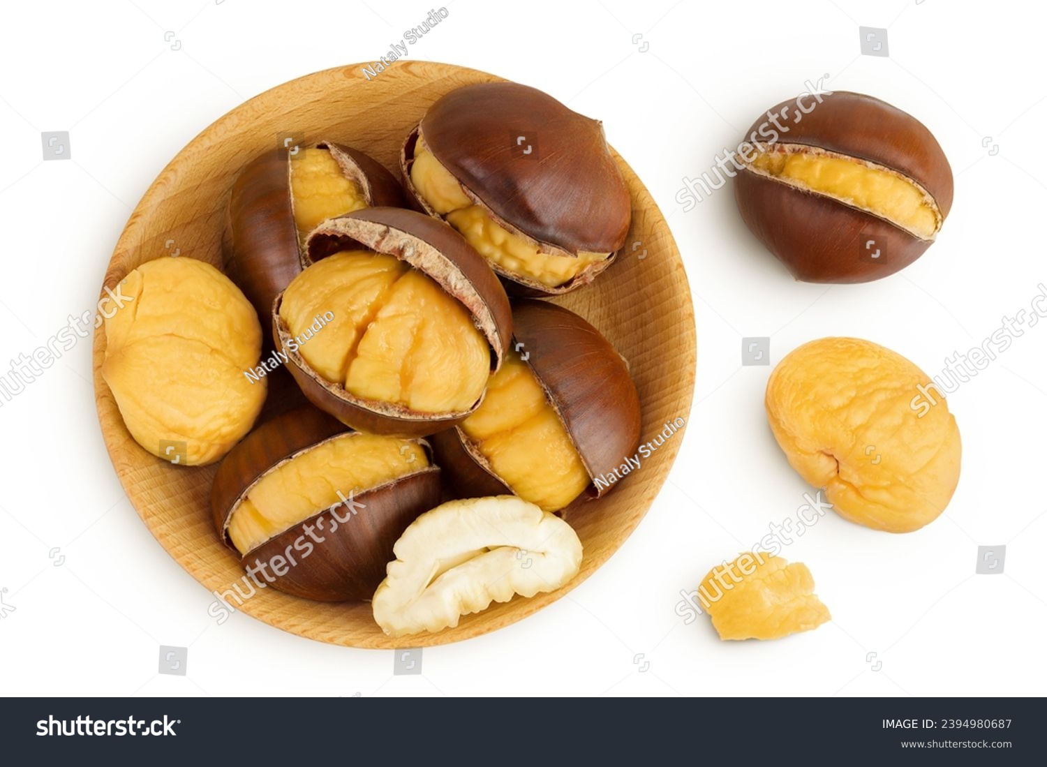 roasted peeled chestnut in wooden bowl isolated on white background. Top view. Flat lay #2394980687