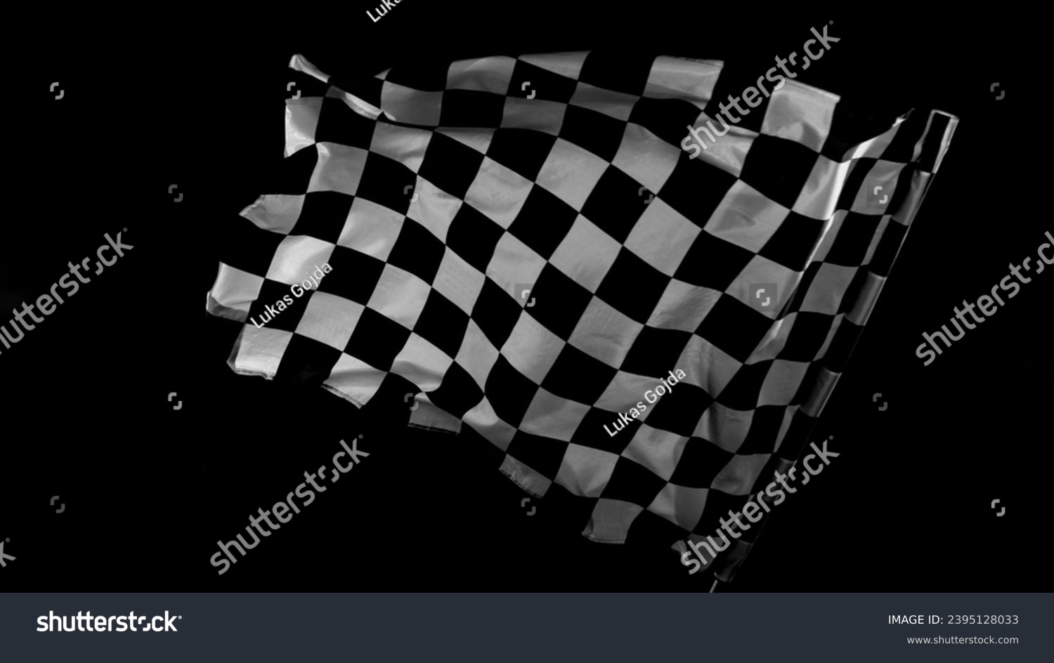 Checkered Race Flag. Freeze Motion Wavy closeup fabric fluttering Racing Flags background. Formula One flag car motor sport. #2395128033