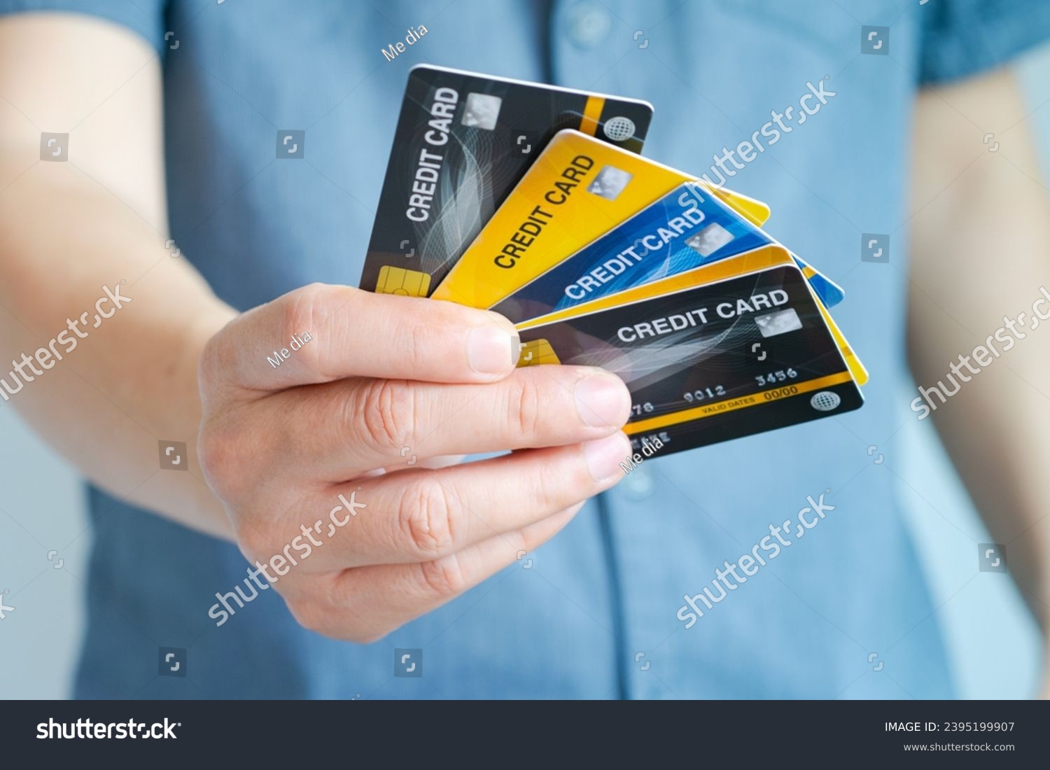 Man holding several credit cards and he is choosing a credit card to pay and spend Payment for goods via credit card. Finance and banking concept. #2395199907