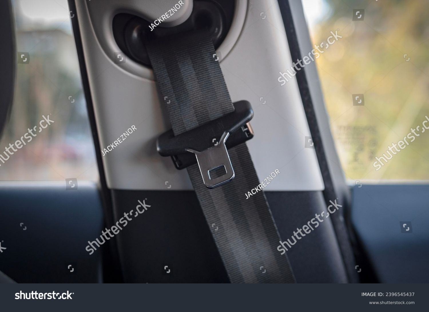 car seat belt close up, Buckle and strap of a car seatbelt.  #2396545437