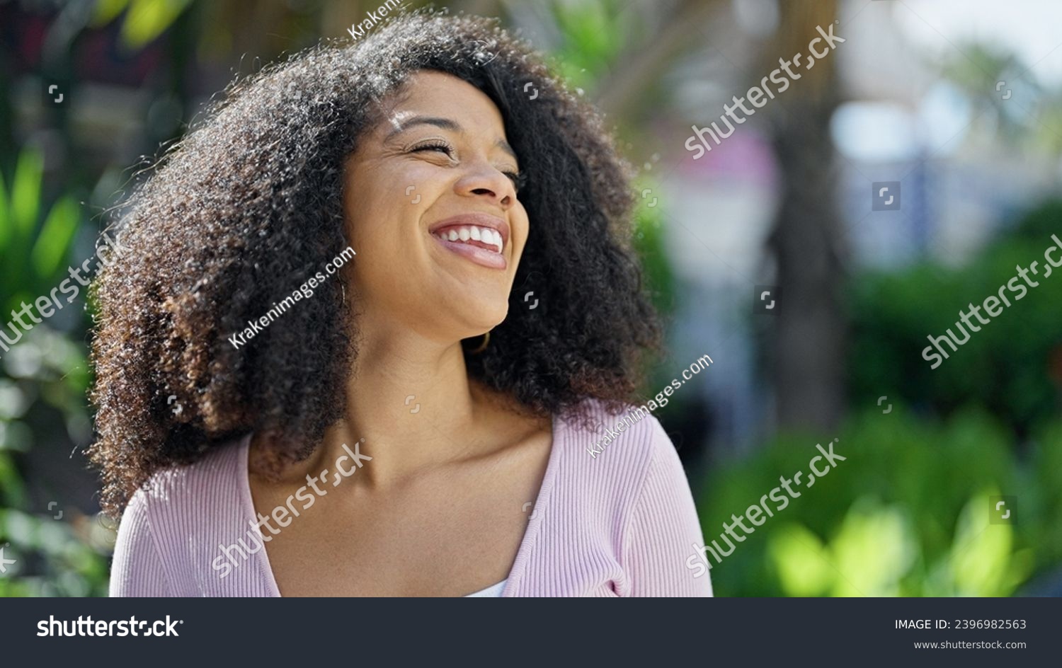 African american woman smiling confident looking to the side at park #2396982563