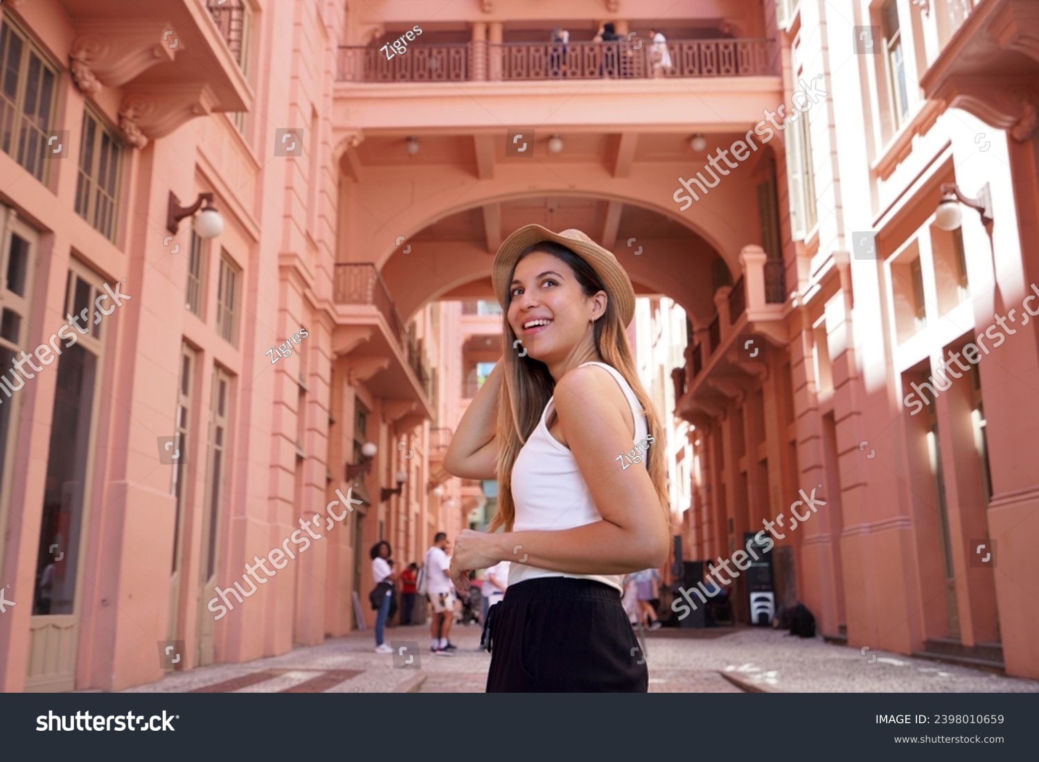 Portrait of young woman visiting the historic palace Casa de Cultura Mario Quintana in Porto Alegre, Brazil #2398010659