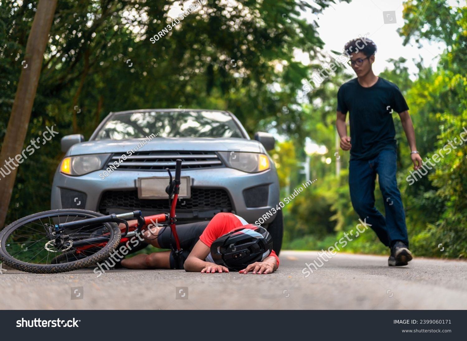 Young Asian man driving a car crashes into a cyclist falls and injures, Cyclist in need of urgent aid, Unexpected Roadside Encounter and Immediate Assistance for Outdoor Mishaps Car Crash. #2399060171