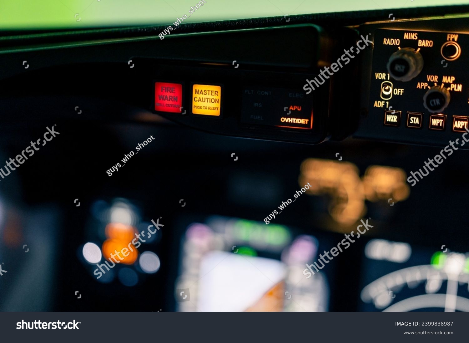 close-up of the cockpit of a passenger plane with many buttons on the control panel of airplane flight simulator #2399838987