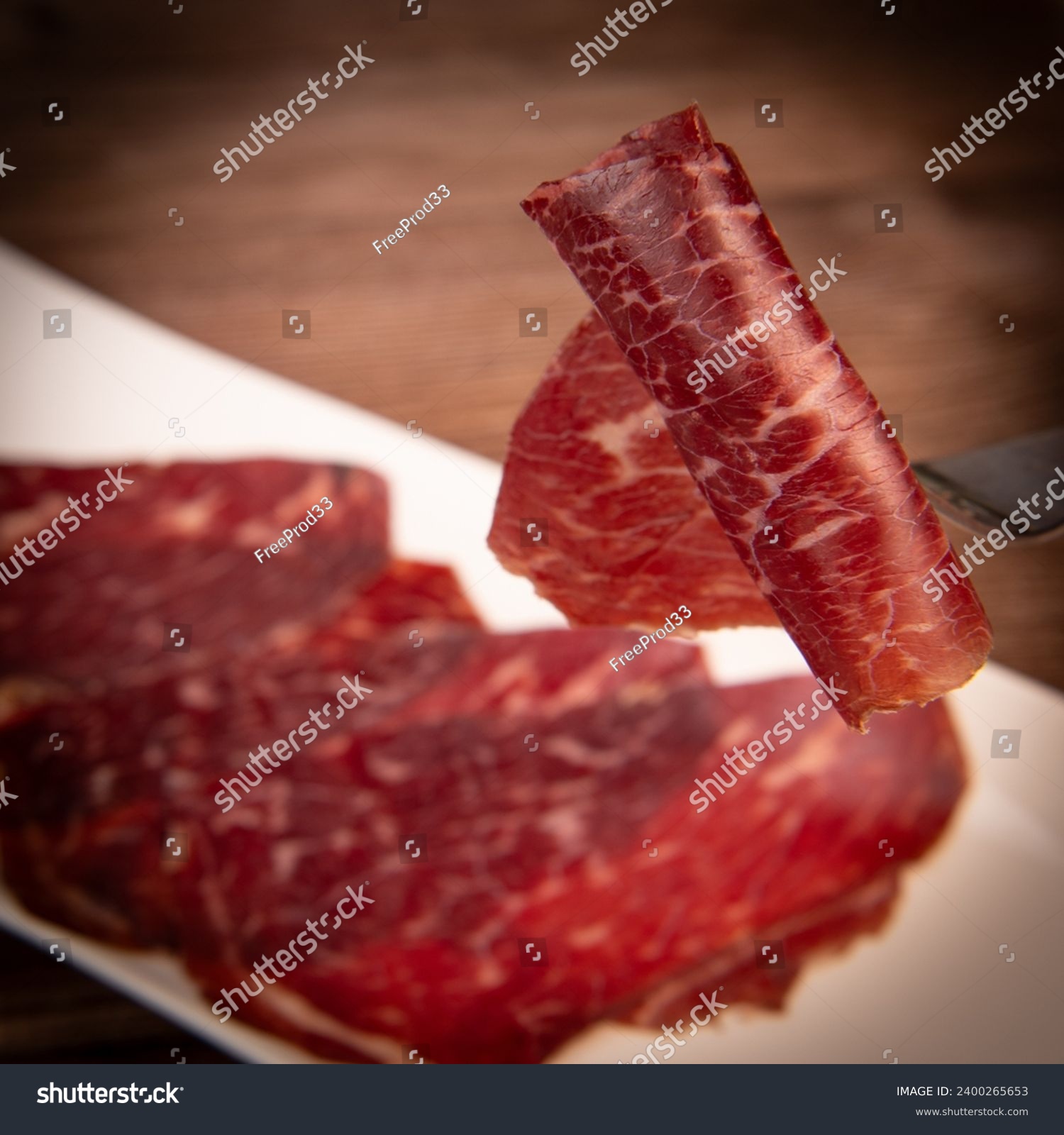 Dry-cured Spanish ham, Serrano ham, Bellota ham, Italian prosciutto crudo or Parma ham, wagyu slice #2400265653