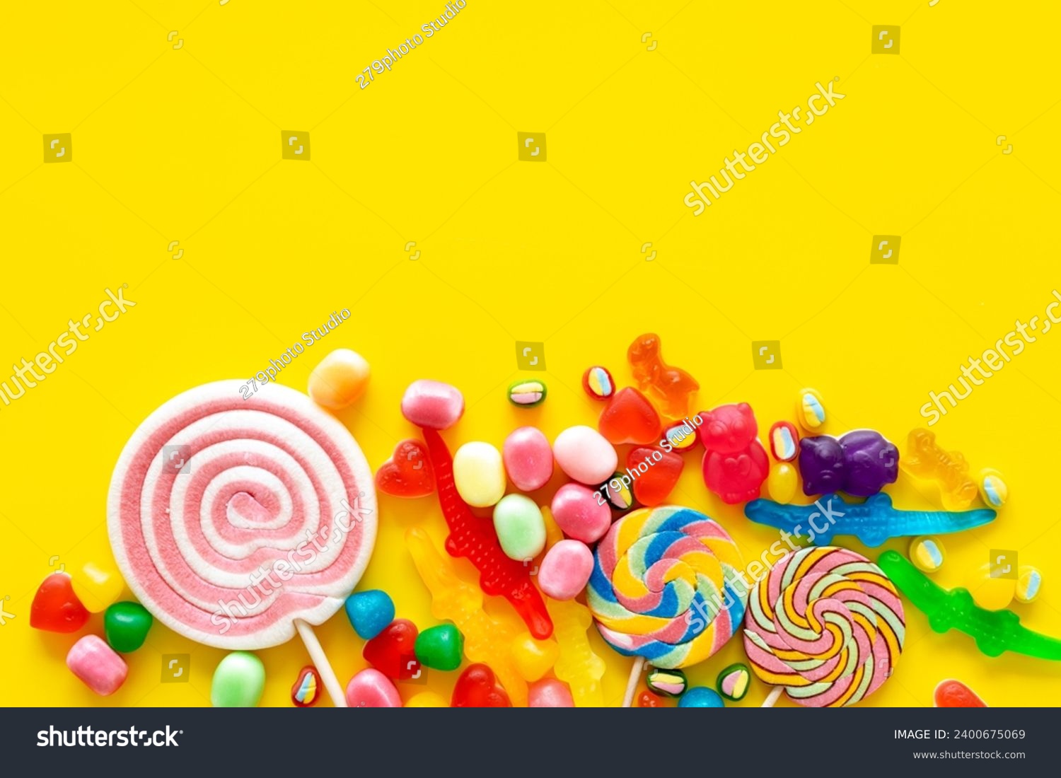 Flat lay of colorful candies and lollipop. Sweet food and candies background. #2400675069