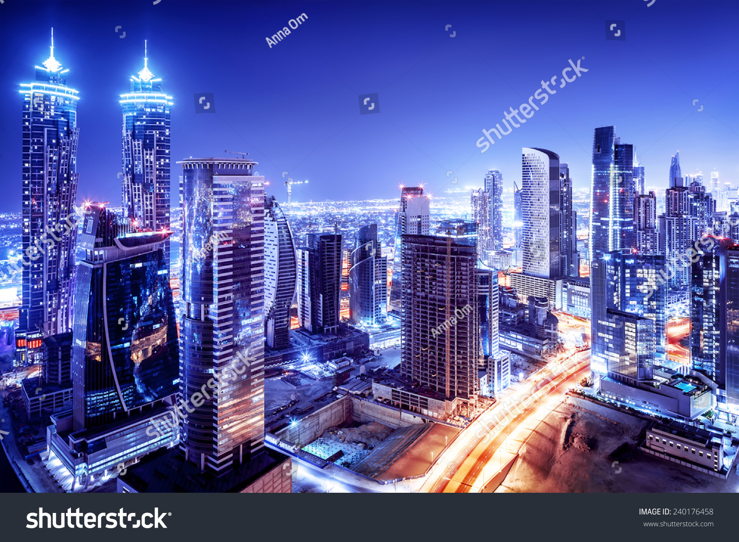Dubai downtown night scene, UAE, beautiful modern buildings, bright glowing lights, luxurious travel and tourism  #240176458