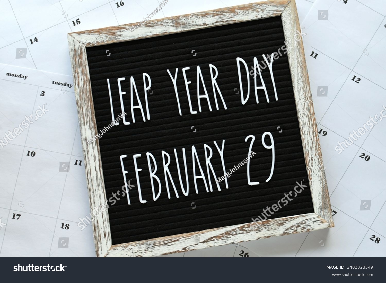 Leap Year Day, February 29, message board flat lay on calendar pages - concept for event that happens every four years.  #2402323349